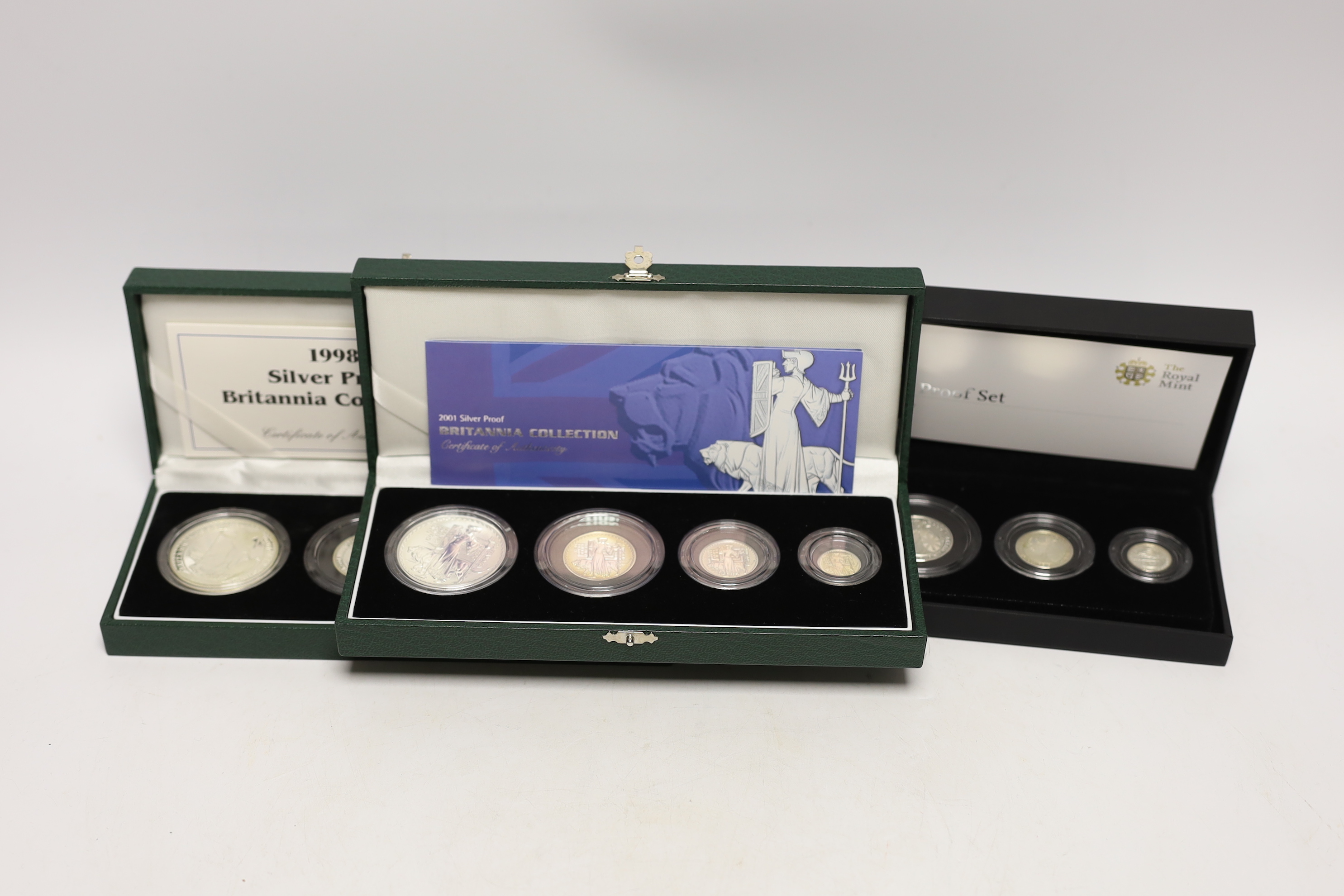 Three Royal Mint UK QEII four-coin silver proof Britannia collection sets for 1998, 2001 and 2008, 3 cases